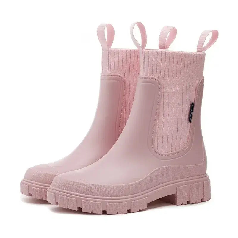 Pink Chelsea rain boots with ribbed elastic collar and chunky slip-resistant sole.