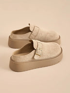 Beige suede women platform clog mules with adjustable buckle and ergonomic comfort sole.