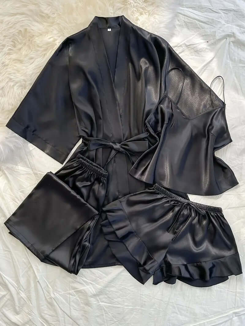 Women's satin pajama set including kimono, cami, trousers, and shorts in sleek black satin.