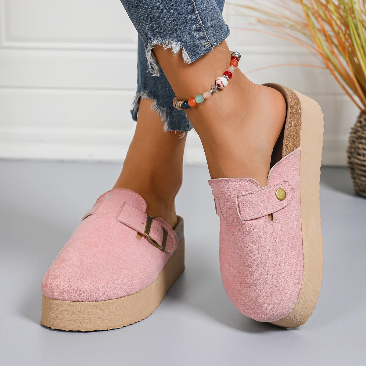 Women’s pink suede slingback platform clogs with thick sole, perfect for casual and chic spring style.