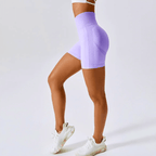 High waisted seamless workout shorts in lavender color, perfect for gym and yoga with supportive ribbed waistband.
