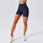 High-waisted seamless running shorts in navy for women, featuring a ribbed waistband and comfortable fit for workouts.