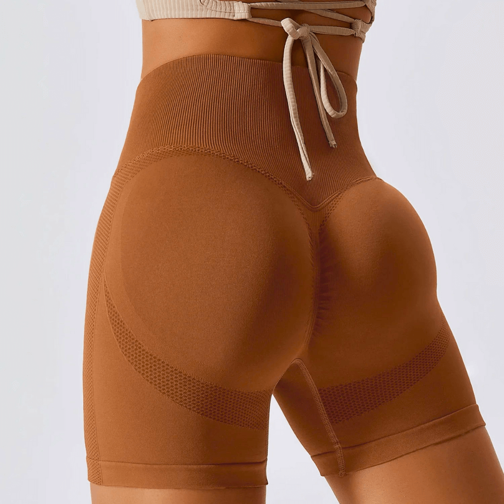 High waisted seamless running shorts for women in brown, featuring a ribbed waistband and contour knit for comfort.