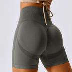 Women's high-waisted seamless workout shorts featuring ribbed waistband and contour knit design for comfort and support.