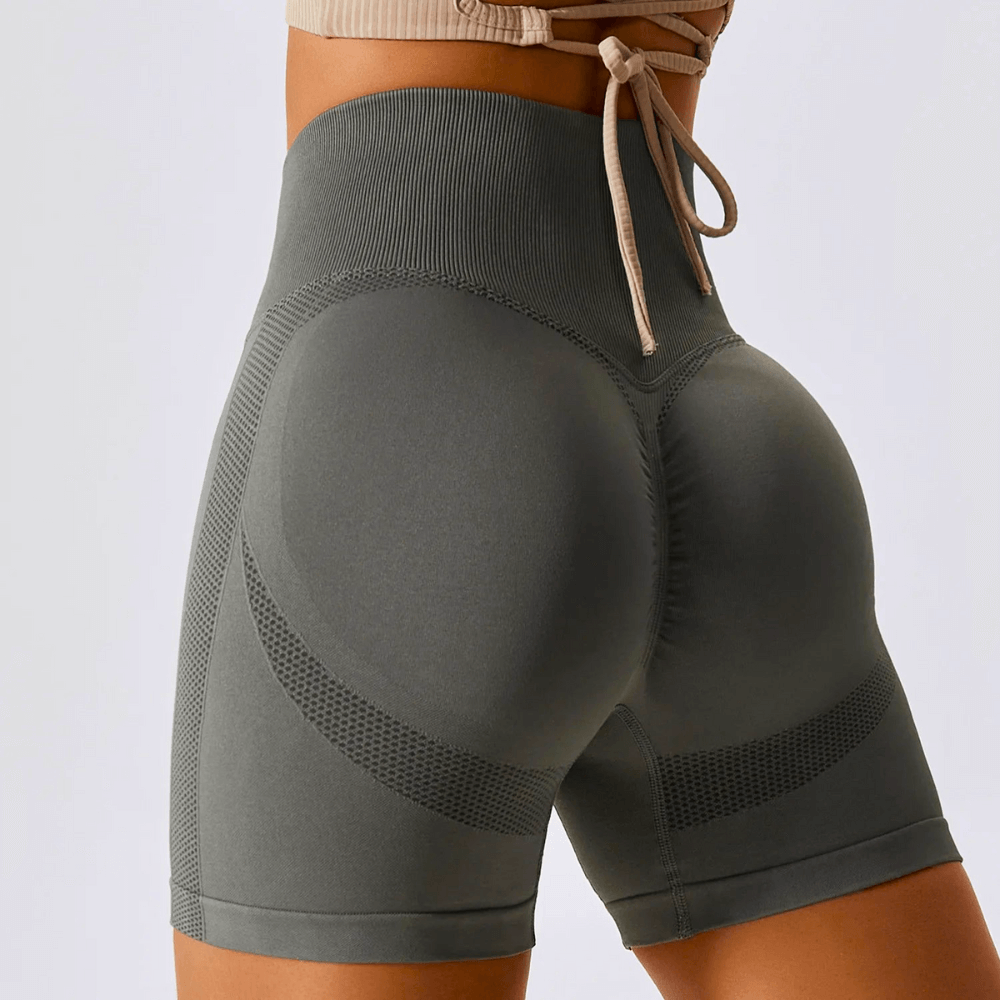 Women's high-waisted seamless workout shorts featuring ribbed waistband and contour knit design for comfort and support.