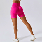 Women’s high-waisted seamless running shorts in bright pink, perfect for workouts and yoga.