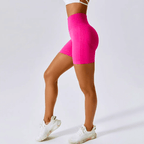High waisted seamless pink running shorts for women, ideal for gym and yoga workouts.
