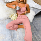 Soft ribbed lace pajama set featuring a camisole and drawstring pants, perfect for lounging and sleep.