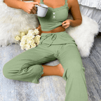 Soft ribbed lace pajama set featuring camisole and drawstring pants in green, perfect for lounging and sleeping.