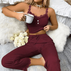 Woman in ribbed lace pajama set enjoying coffee, showcasing comfort and style in soft, breathable fabric.