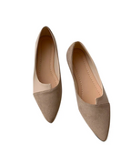 Pointed toe flats in soft beige faux suede with comfortable slip-on design for stylish everyday wear.