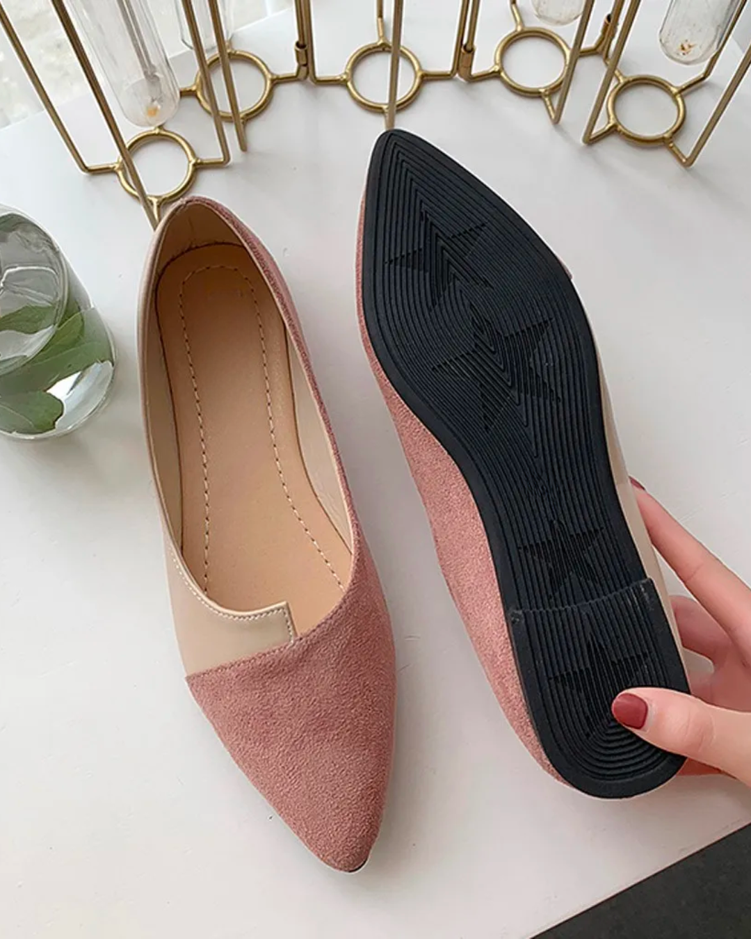 Pointed toe flats in soft faux suede with a black sole, perfect for comfort and style in everyday wear.