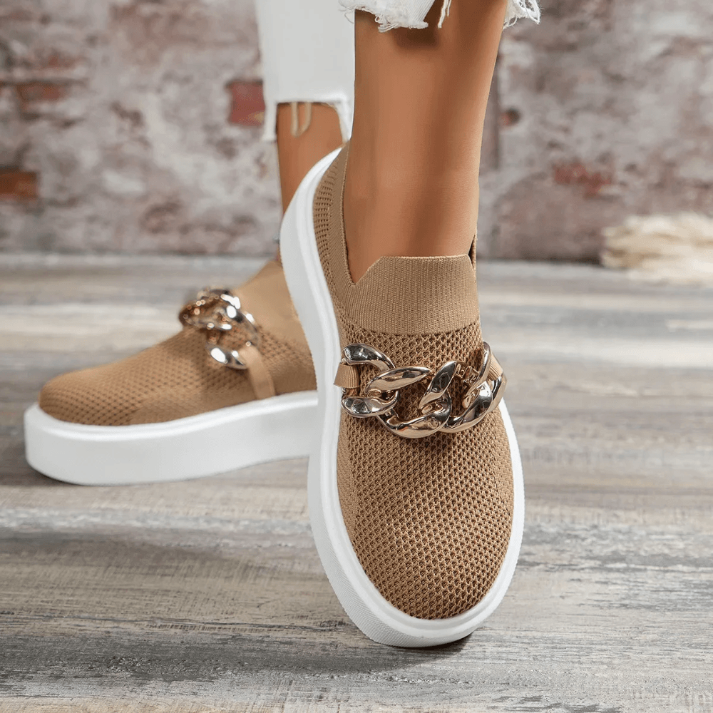 Stylish orthopedic women’s walking shoes with breathable mesh, chain detail, and cushioned sole for comfort.