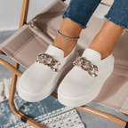 Stylish women's white mesh slip-on shoes with decorative chain detail, perfect for casual wear.