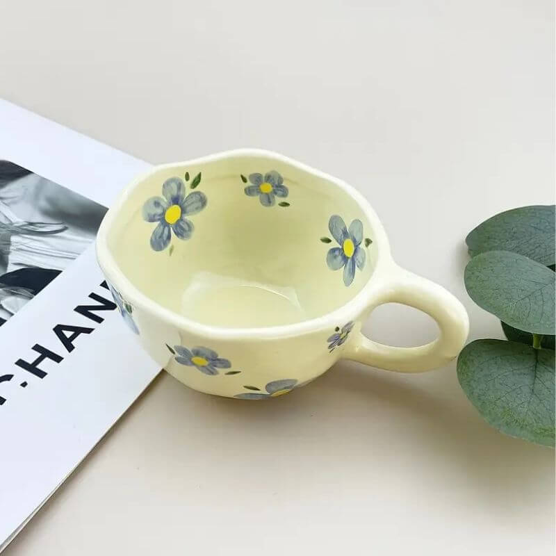 Flower pattern ceramic mug with irregular hand-drawn design, perfect for coffee or tea. Vintage style. Unique and charming.